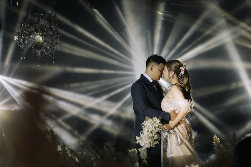 Bride & Groom dance with dramatic lighting