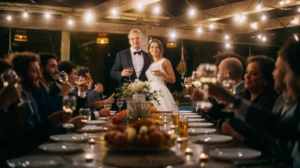 bride and groom enjoying dinner at their wedding recpetion