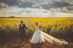 bride & groom in a field of sunflowers