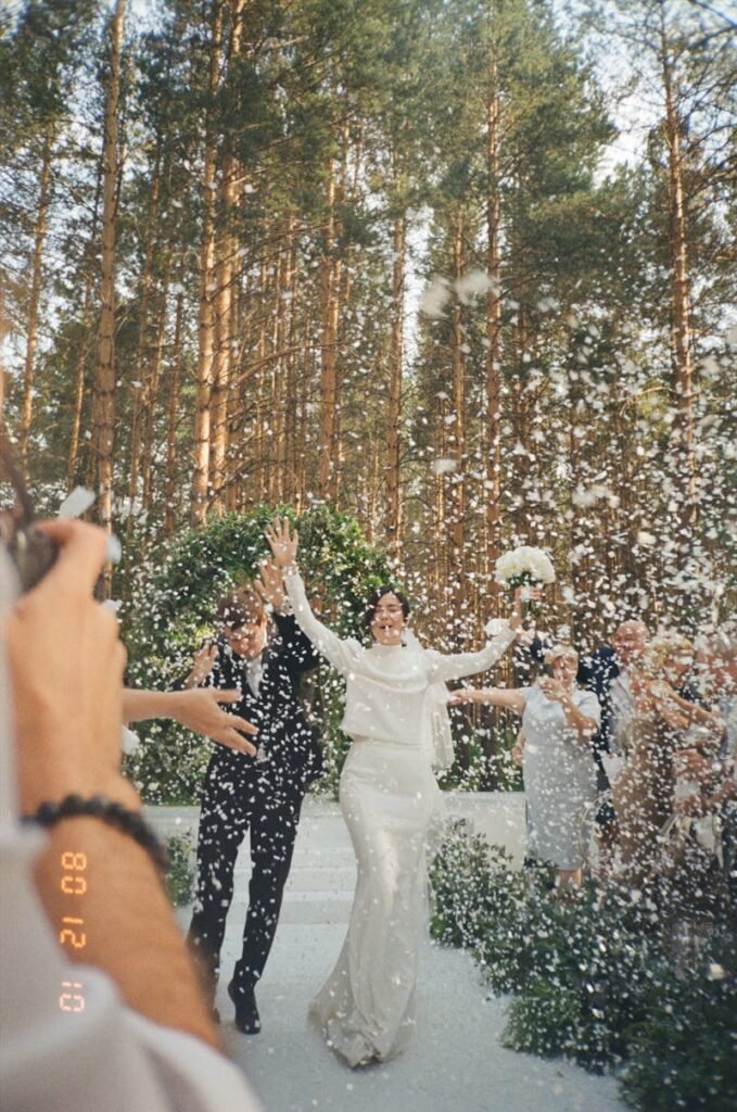 Bride and groom with snow flying, winter wedding