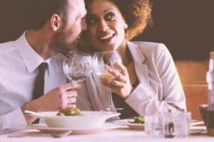 Engaged couple at rehearsal dinner