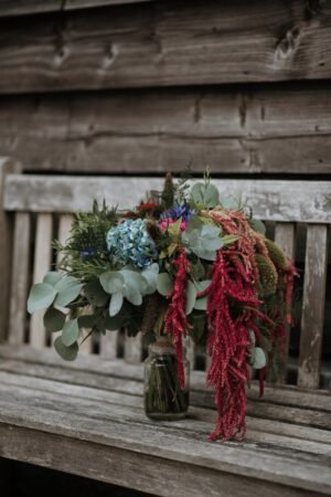 Flower arrangement using terracotta and sage