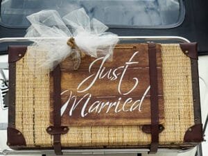 Wedding sign just married on a vintage suitcase