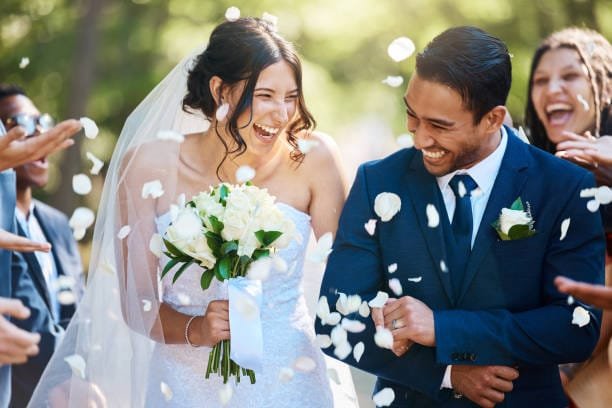 bride and groom standing at altar during wedding ceremony
