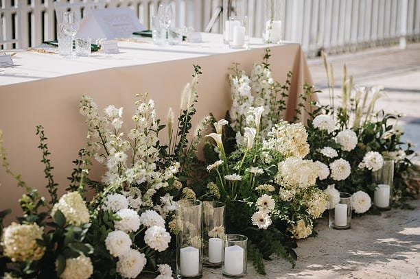 meadowcore grounded floral arangement head table
