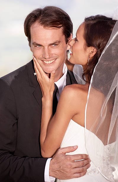 Bride and groom sharing private wedding vows